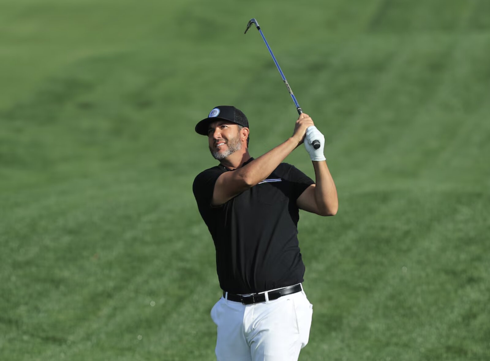 Scott Piercy mid-swing, driving off the tee